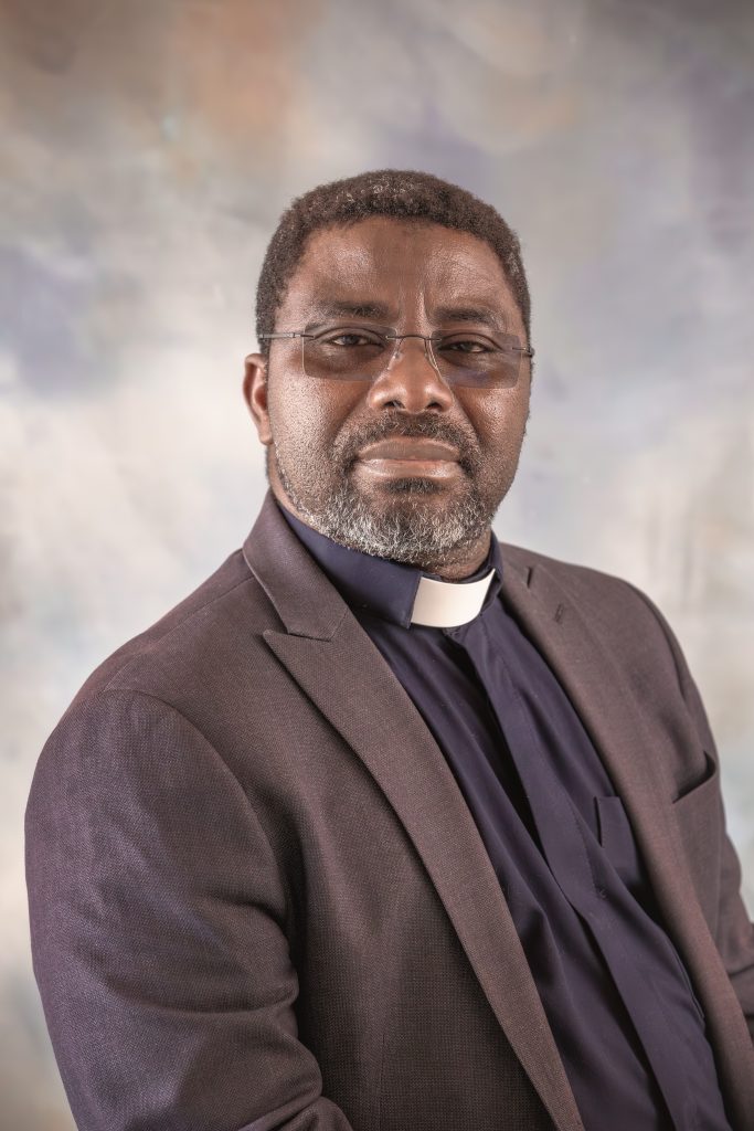Father Richard Awange, pastor and priest at All Saints Catholic School, leading a school service