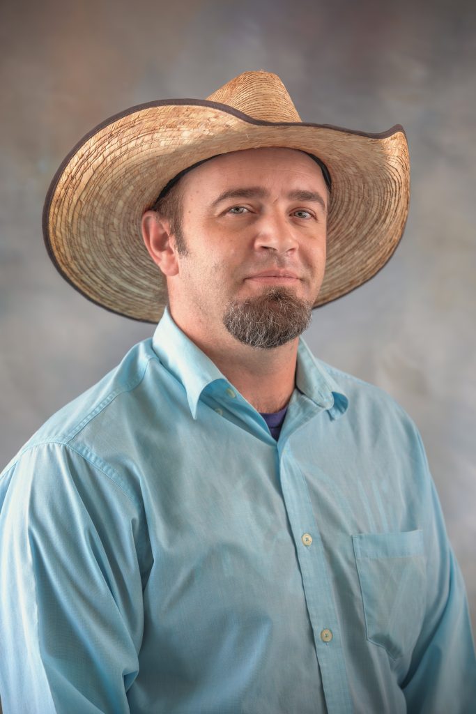 James Mustard, 5th and 6th Grade Teacher at All Saints Catholic School, supporting student learning and academic growth