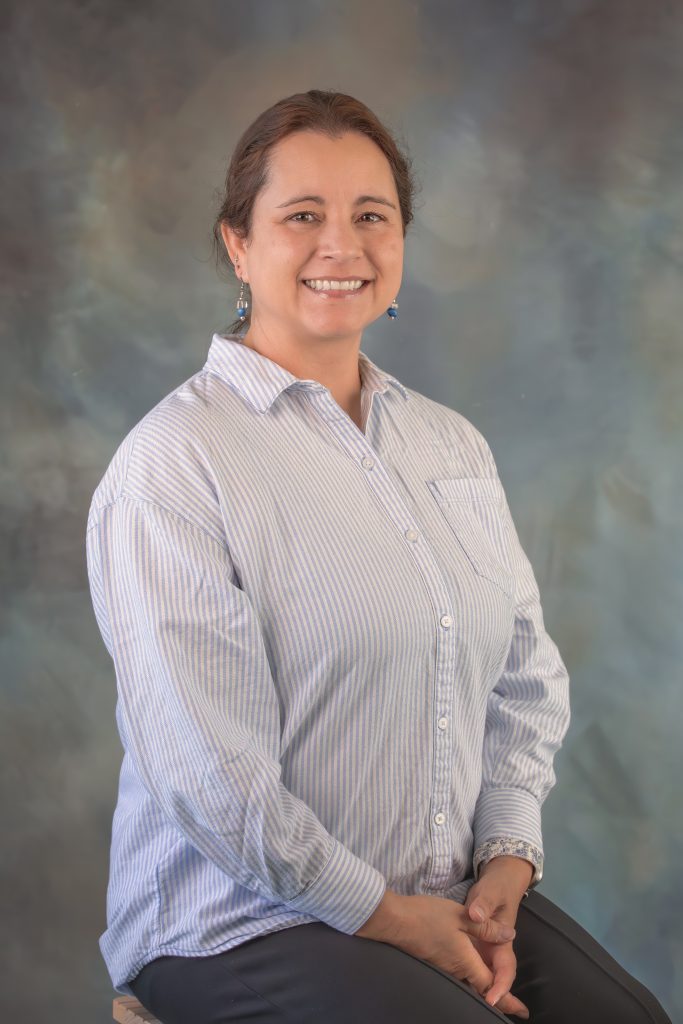 Nicole Garcia, substitute teacher at All Saints Catholic School, teaching students in the classroom